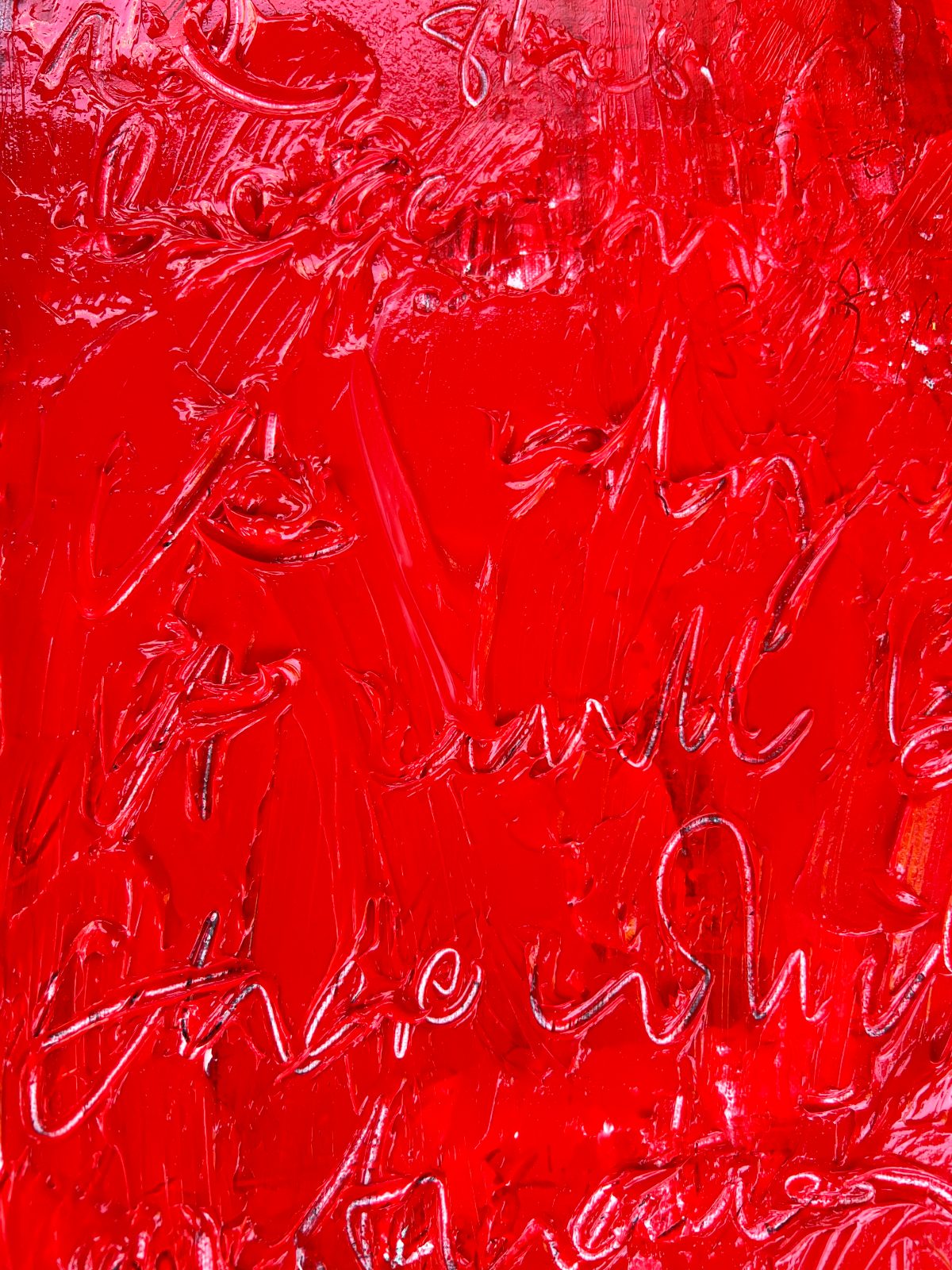 Detail of journalled writing scratched into wet red paint